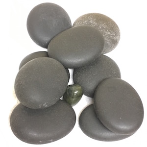 An arrangement of polished grey pebbles