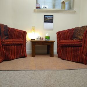 Two armchairs set up for counselling